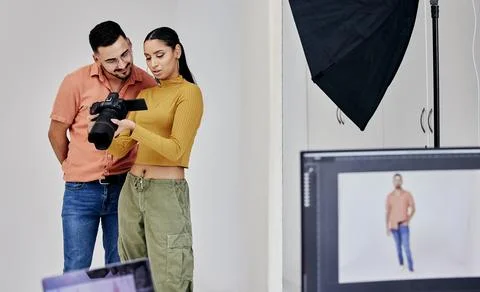 Teamwork, photographer and startup people with camera in studio set for shoot Stock Photos