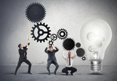 Teamwork powering an idea Foto stock