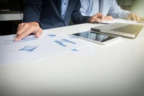 Teamwork process, Businessmen hands pointing at document during explanation o Stock Photos