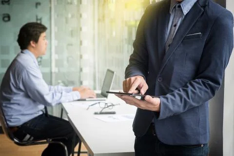 Teamwork process, Young businessmen working with document and laptop during e Stock Photos