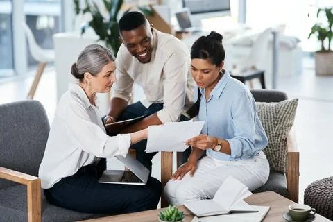 Teamwork provides improved efficiency at work. a group of businesspeople going Stock Photos