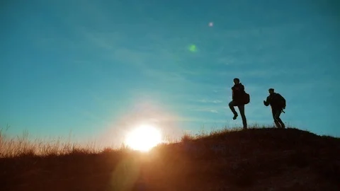 Teamwork run jump throw backpacks happiness joy victory success. Two hikers Video stock 98072619