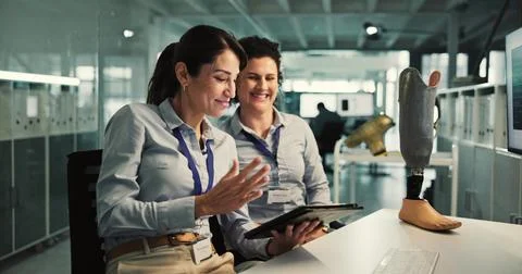 Teamwork, tablet and laboratory for prosthetic leg research, report or futu.. Stock Photos