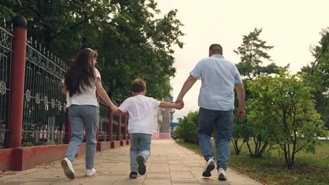 Teamwork, three people, three people outdoors, family uniting into team, young Stock Footage 305744761