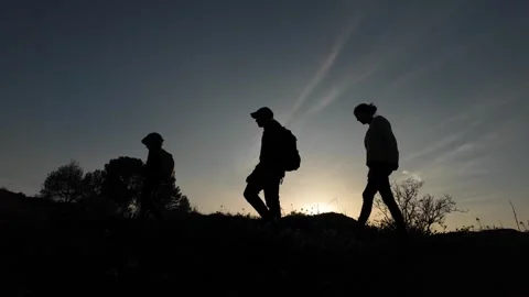 Teamwork Triumphs as Three Brave Souls Conquer the Mountains Video stock 270452959