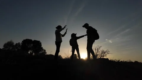 Teamwork Triumphs as Three Brave Souls Conquer the Mountains Video stock 270453041