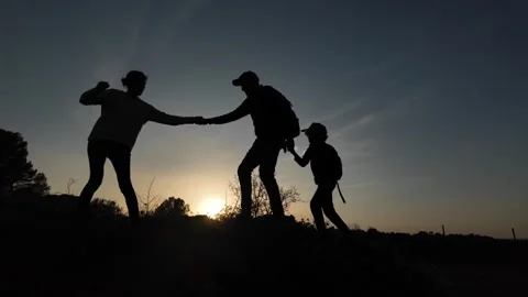 Teamwork Triumphs as Three Brave Souls Conquer the Mountains Video stock 270453055