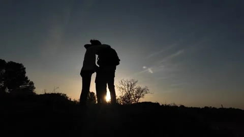 Teamwork Triumphs as Three Brave Souls Conquer the Mountains Video stock 270453060