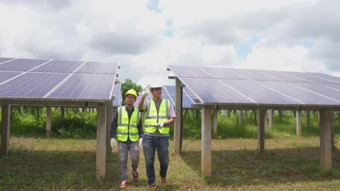 Teamwork two engineers are working to install solar panels. Stock Footage 210818431