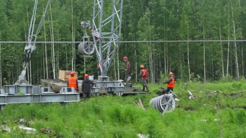 Teamwork Under Grey Skies: Securing the Energy Grid Stock Footage 263539624