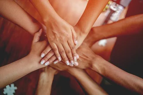 Teamwork unity and cooperation concept hand close up of the hand connecting.. Stock Photos