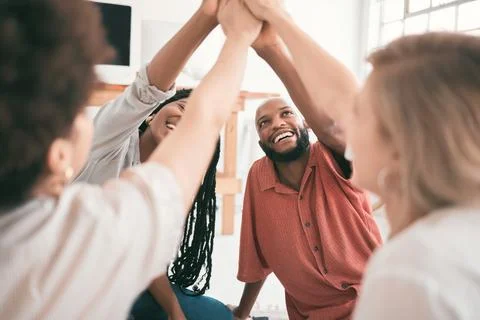 Teamwork, unity and high five from young students having fun while sitting Stock Photos