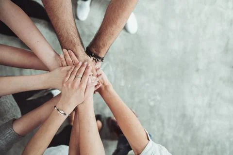 Teamwork, unity concept, group of friends put their hands together Stock Photos
