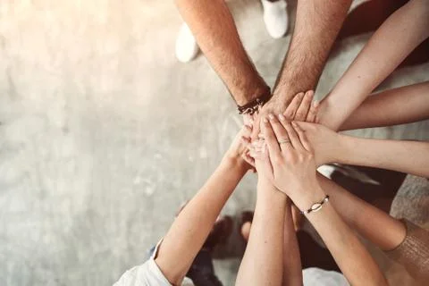 Teamwork, unity concept, group of friends put their hands together Stock Photos