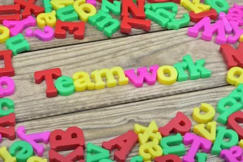 Teamwork on wooden table Stock Photos