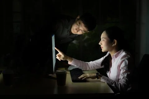 Teamwork working Late at night. Stock Photos