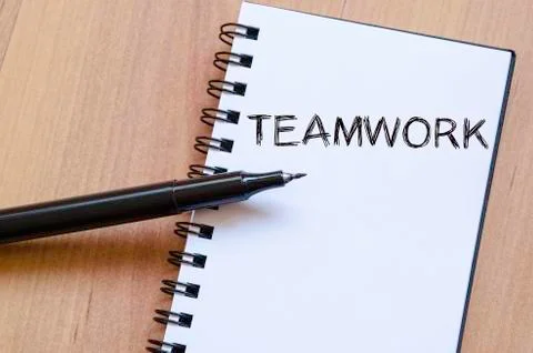 Teamwork write on notebook Stock Photos