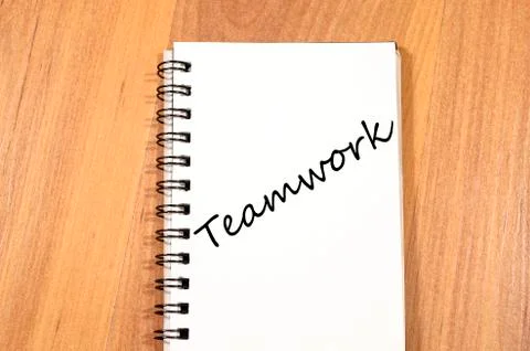 Teamwork write on notebook Stock Photos