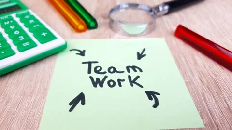 Teamwork,business,text,word,writing,note on a sheet the table,business concep Stock Footage 312049665