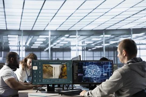 Teamworking colleagues coding AI virtual assistant producing clips 스톡 사진