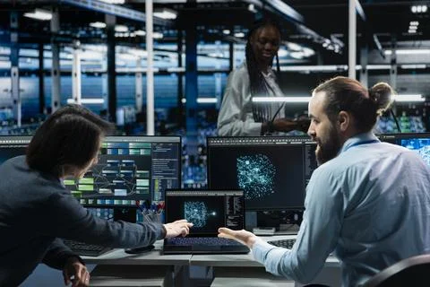 Teamworking colleagues in data center using AI LLM assistant to do maintenance Stock Photos