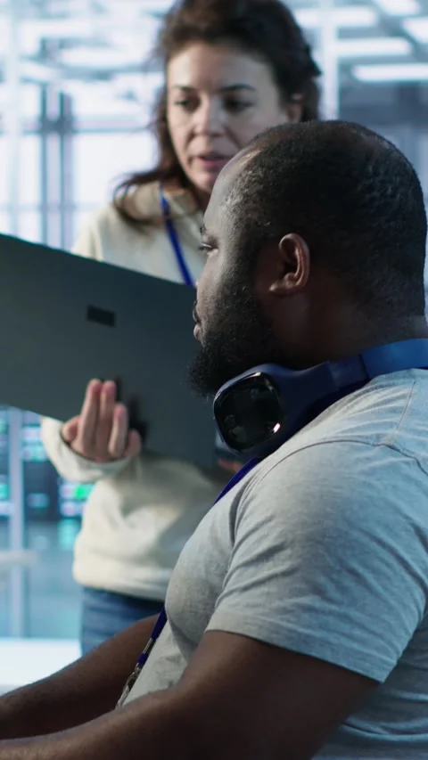 Teamworking colleagues updating AI systems on PC and laptop Stock Footage 319536639