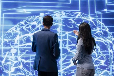 Teamworking coworkers implementing artificial intelligence Stock Photos