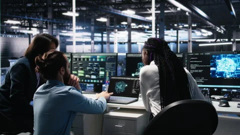 Teamworking data center technicians using machine learning algorithms Stock Footage 313569536