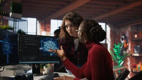 Teamworking engineers coding advanced AI algorithm in startup Stock Photos