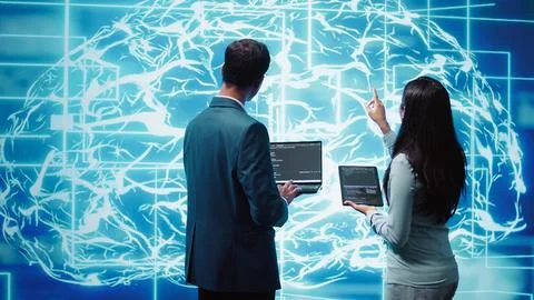 Teamworking IT staff members using AI system aiding in processing 写真素材