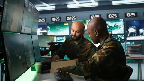 Teamworking military agents look at intel folder files Stock Footage 282136096