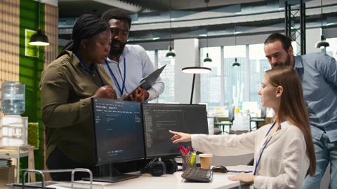 Teamworking programmers developing software applications, working together Stock Footage 313018467