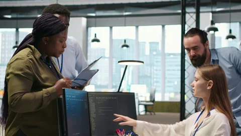 Teamworking programmers developing software applications, working together Stock Footage 313168500