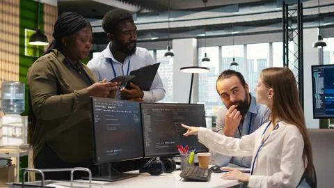Teamworking programmers developing software applications, working together Stockfoto's