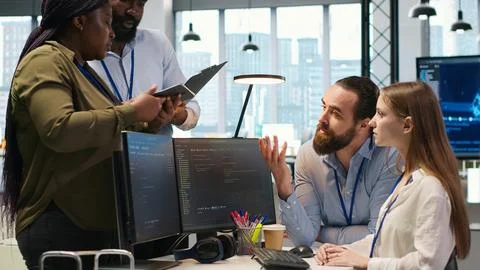 Teamworking programmers developing software applications, working together 스톡 사진