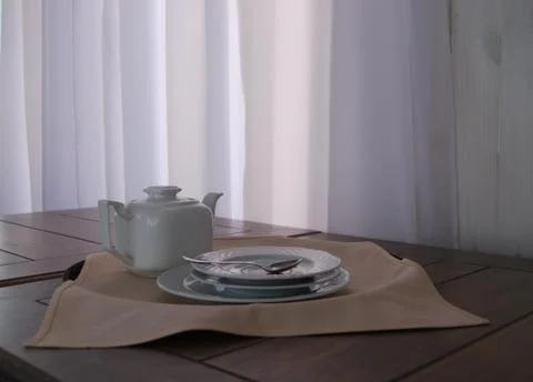 Teapot And  Plates Stock Photos