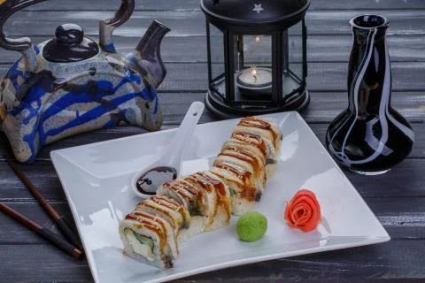 Teapot and sushi set with eel fish, nigiri, maguro and sushi rolls served on  Stock Photos