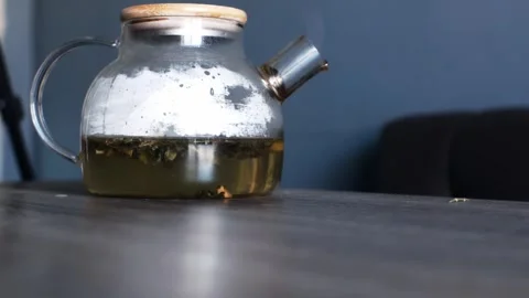 The teapot is covered with a lid. Brewing tea. Fruit and herbal collection.  Stock Footage 304160936