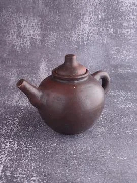 Teapot from earthenware (pottery). Stock Photos
