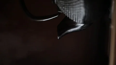 Teapot fuming with dark background Stock Footage 107177405