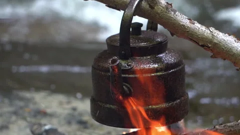 Teapot Heating Over Open Fire. Close-up Video stock 311667369