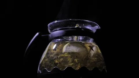 Teapot with a hot tea. Lemon blizzard in a teapot. Stock Footage 83487238
