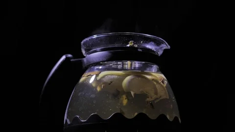 Teapot with a hot tea. Lemon blizzard in a teapot. Stock Footage 83487265