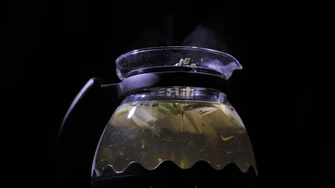 Teapot with a hot tea. Lemon blizzard in a teapot. Stock Footage 83487316