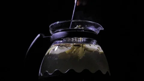 Teapot with a hot tea. Lemon blizzard in a teapot. Stock Footage 83487336