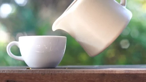 Teapot pouring tea Stock Footage 70574346