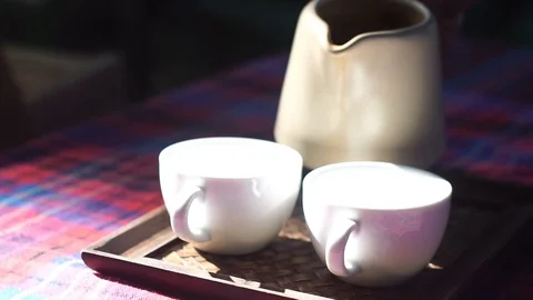 Teapot pouring tea. slow motion shot Stock Footage 70574592