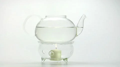 Teapot on teapot warmer Stock Footage 8572369