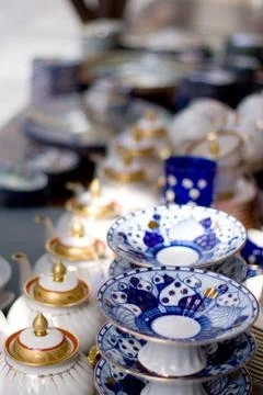 Teapots and plates Stock Photos