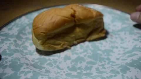 A tear bread shows apple sugar jam inside of it food showcase Video stock 275640227